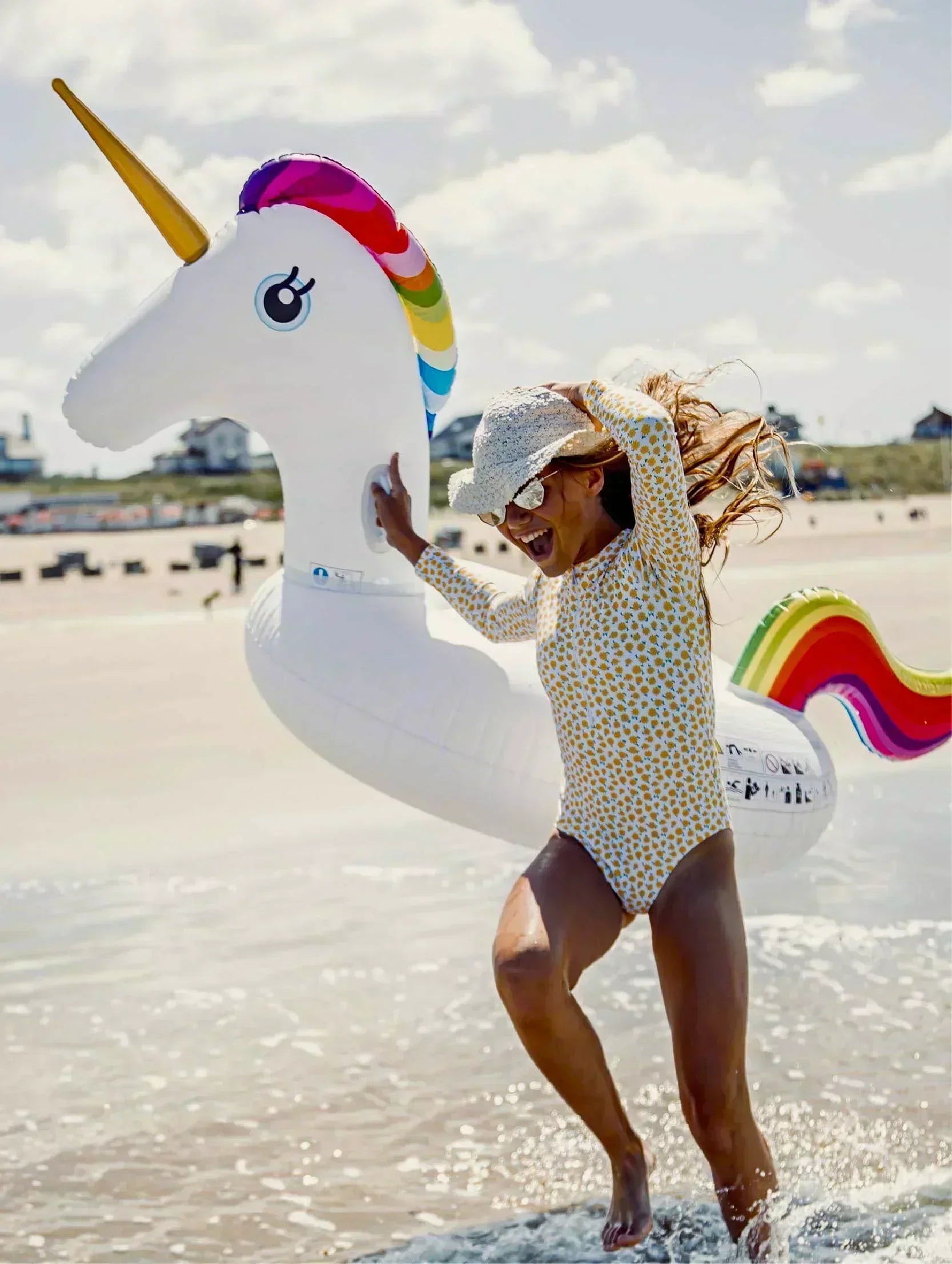 inflatable unicorn on beach