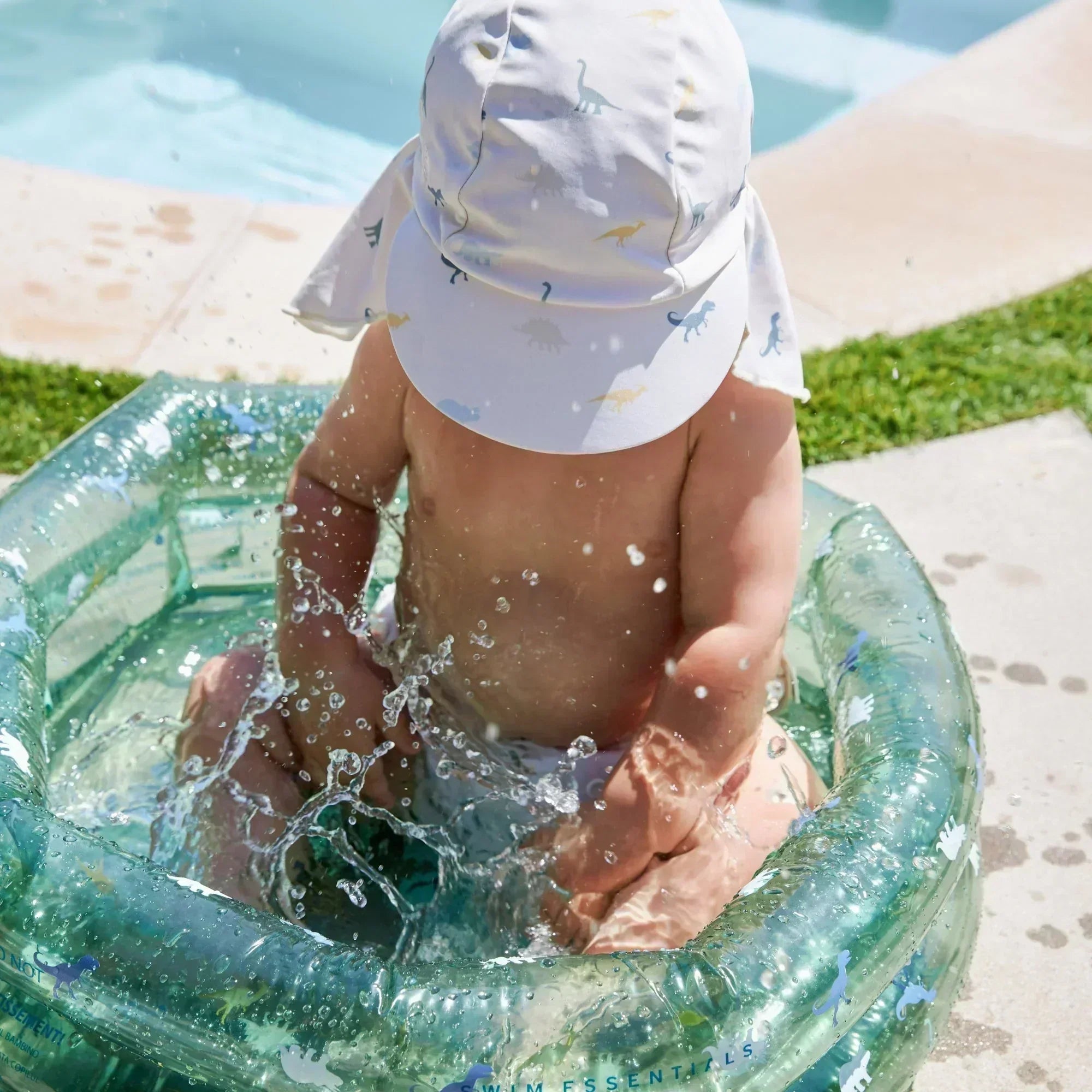 baby splashing in a baby pool