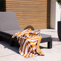 strandlaken-135x65cm-vibrant-stripes-oranje-swim-essentials-4