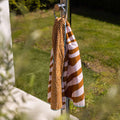 strandlaken-135x65cm-vibrant-stripes-oranje-swim-essentials-5